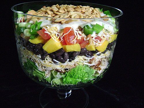 /><br/> <br/> This is a super salad for a hot night. I do the chopping and layering early in the morning, get the dressing made and into the refrigerator it goes until supper time.<br/> <br/> My only suggestion is when you get the yogurt for the dressing, you'd better buy 2 of them. I usually double the dressing amount for this. Bob tends to be a tad heavy handed with it on his helping so a single batch isn't enough for the leftovers. I spoon half over the top of the salad and serve the other half on the side.<br/> <br/> It's really good-and pretty too!</span></div> <div><span style=